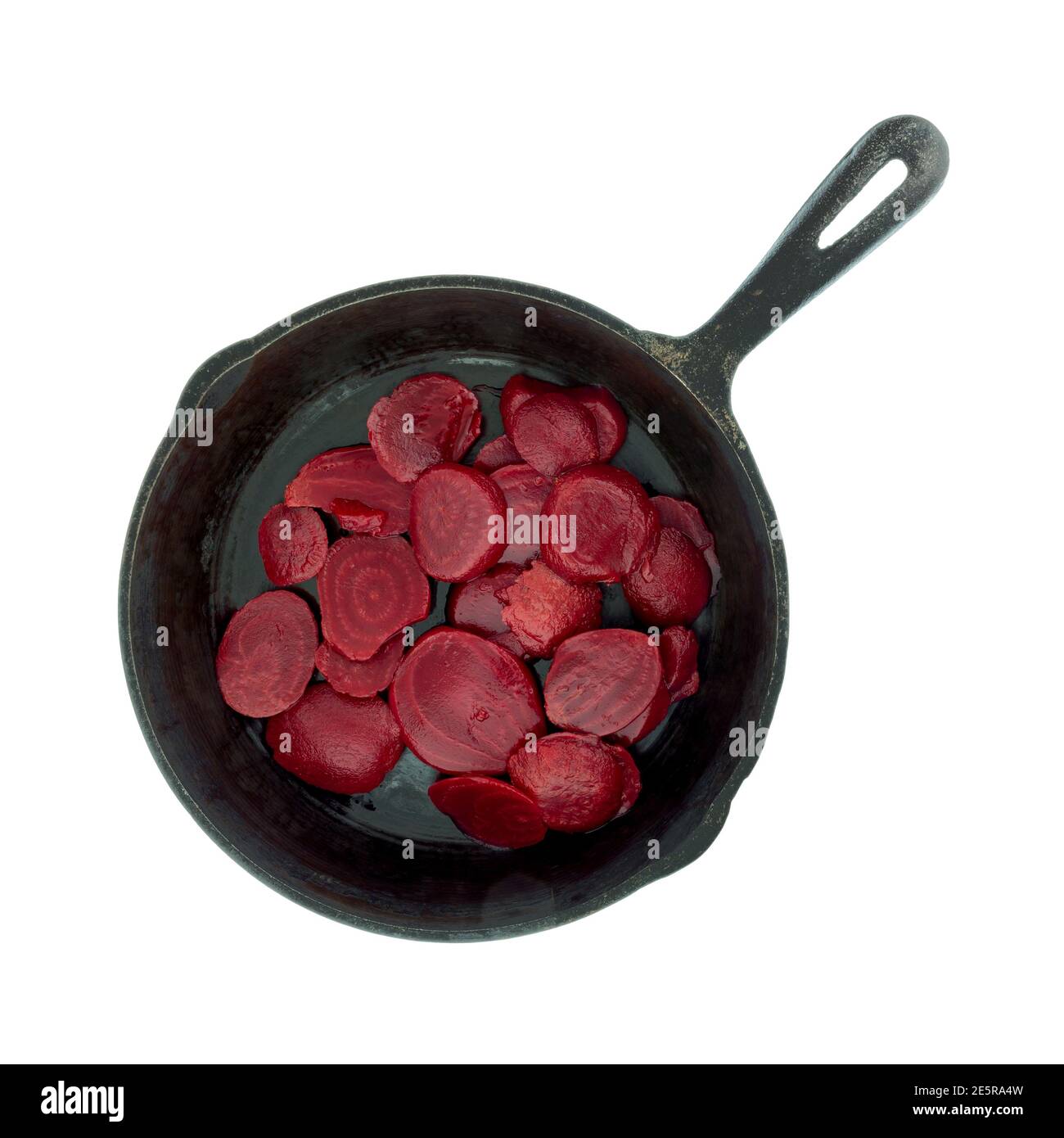 Top view of canned sliced beets in a cast iron skillet isolated on a