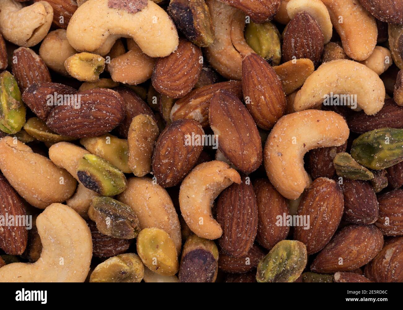 Top close view of pistachio, almonds and cashews nuts. Stock Photo