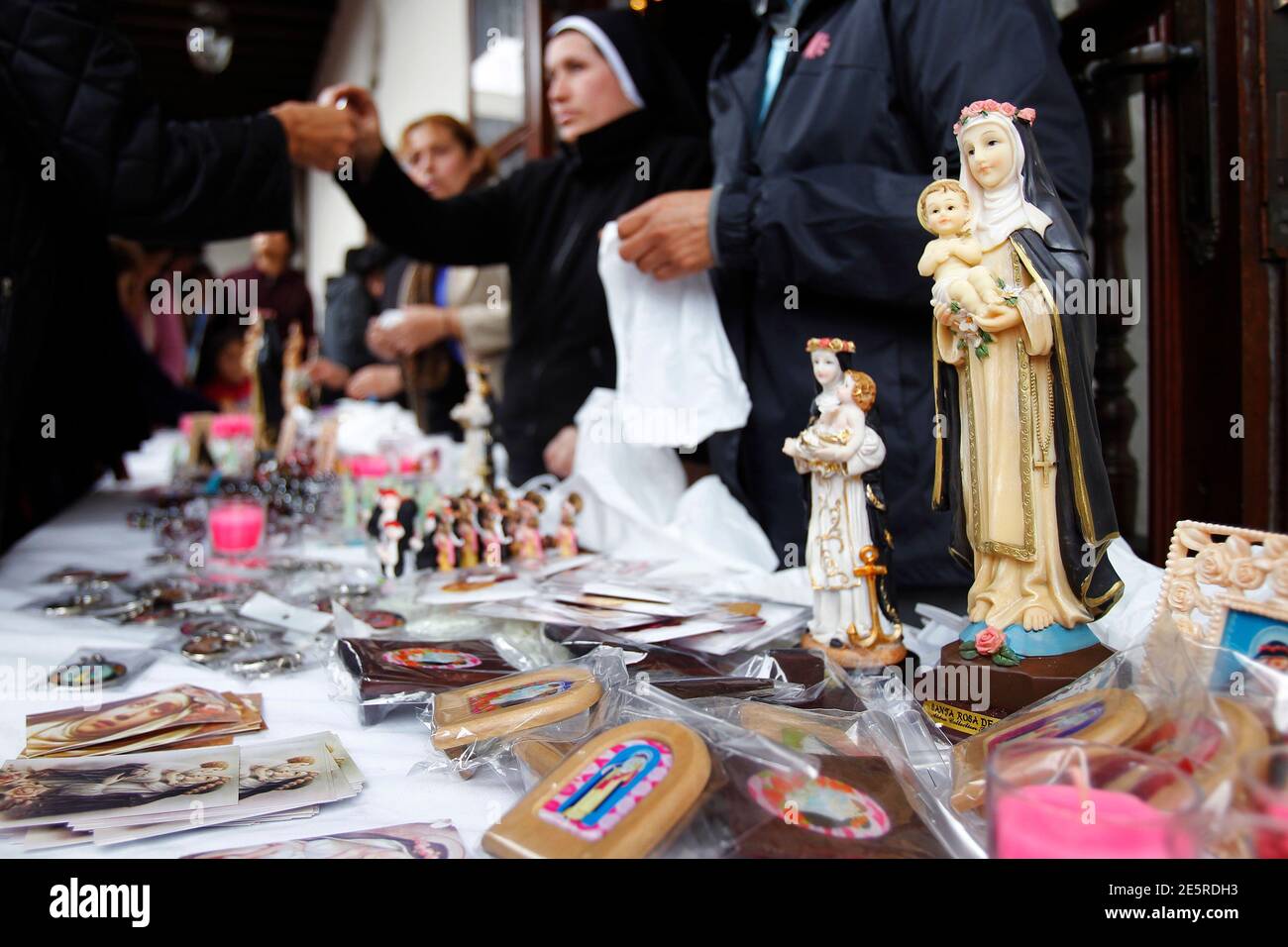 Souvenirs of Saint Rose are sold at Saint Rose's Church during her  anniversary celebrations in Lima, August 30, 2013. Thousands of people  visit the sanctuary every year with the hope of seeing