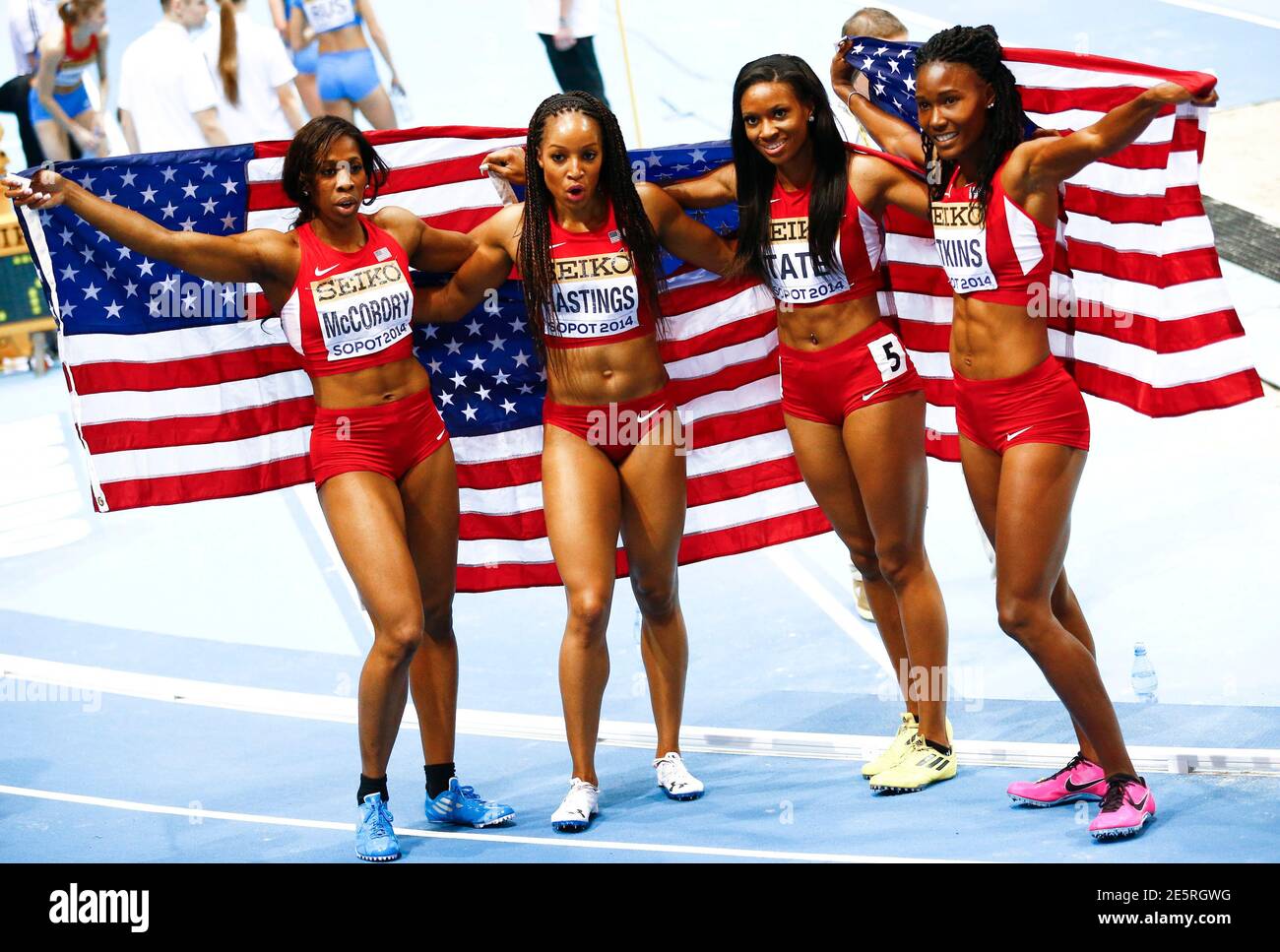 First placed U.S. athletes Francena McCorory, Natasha Hastings, Cassandra  Tate and Joanna Atkins (L-R) pose as they celebrate after the women's 4x400  metres relay final at the world indoor athletics championships at