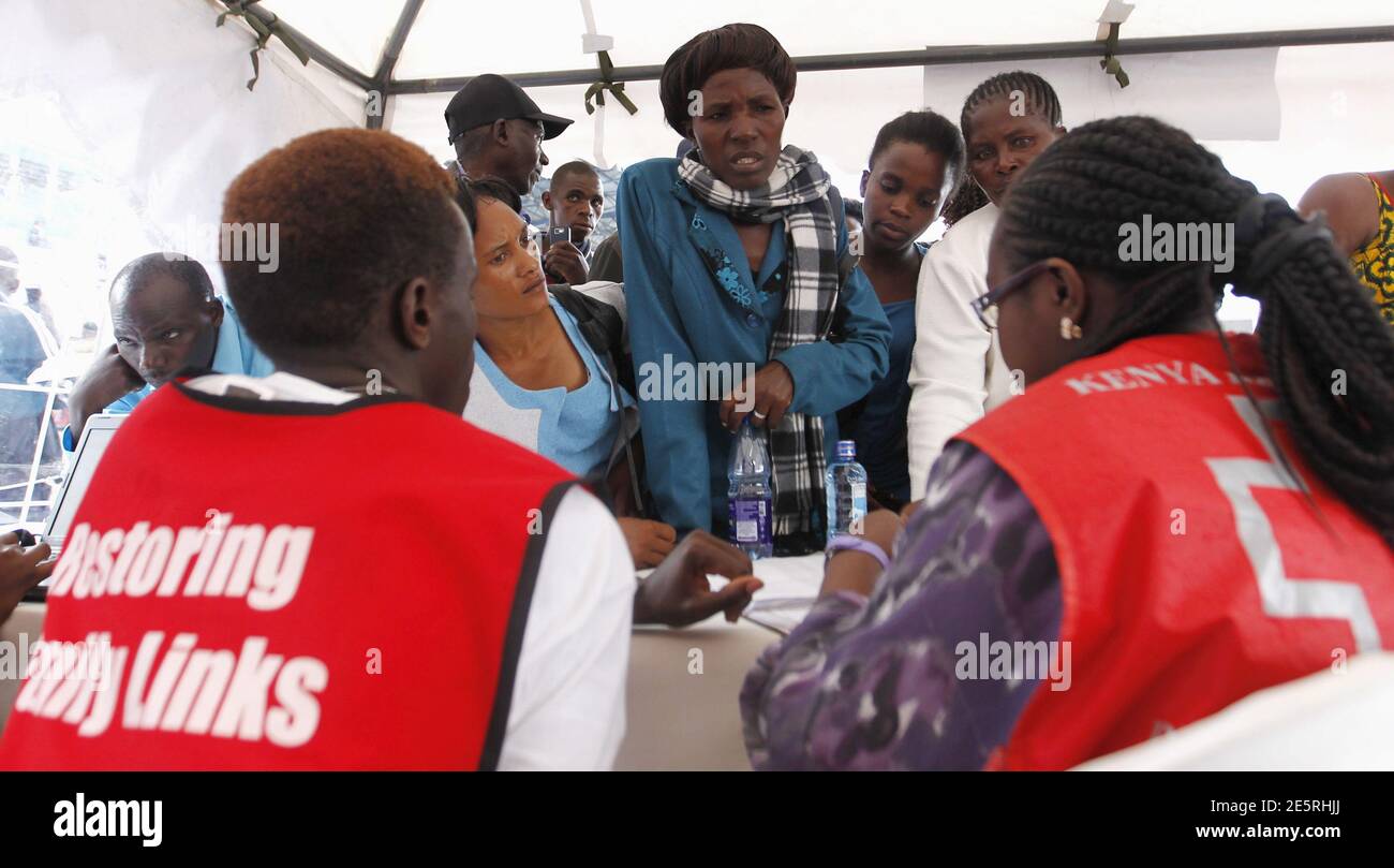 Kenya Red Cross staff talk to relatives of students who survived in last Thursday's attack by gunmen, in the capital Nairobi April 4, 2015. Somali militants vowed on Saturday to wage a long war against Kenya and run its cities 'red with blood' after the group's fighters killed nearly 150 people during an assault on a Kenyan university. REUTERS/Thomas Mukoya Stock Photo