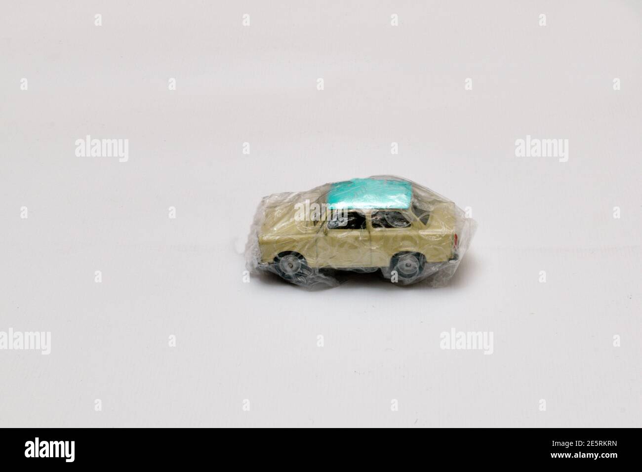 Miniature car wrapped in protective film with bubble in the center of