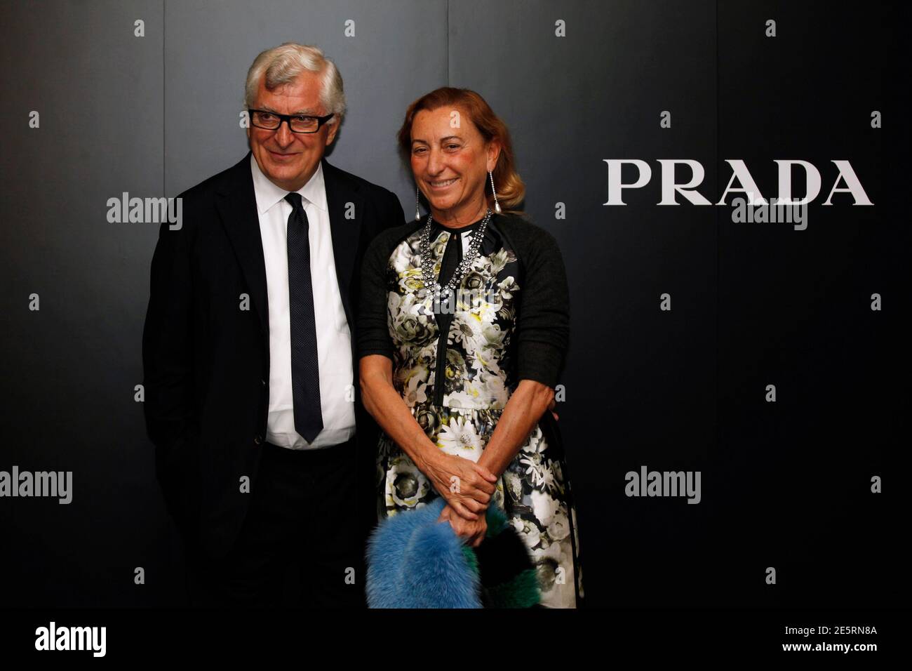 Prada's Chief Executive Patrizio Bertelli (L) poses with his wife, fashion  designer Miuccia Prada, after attending a fashion show as part of an  investors launching presentation ahead of Prada's IPO in Hong