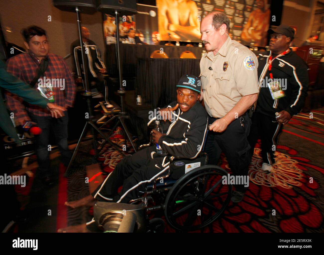Timothy Jr. of the U.S. leaves a news conference in a wheelchair after injuring left during the WBO welterweight champion fight against Manny Pacquiao of the Philippines at the