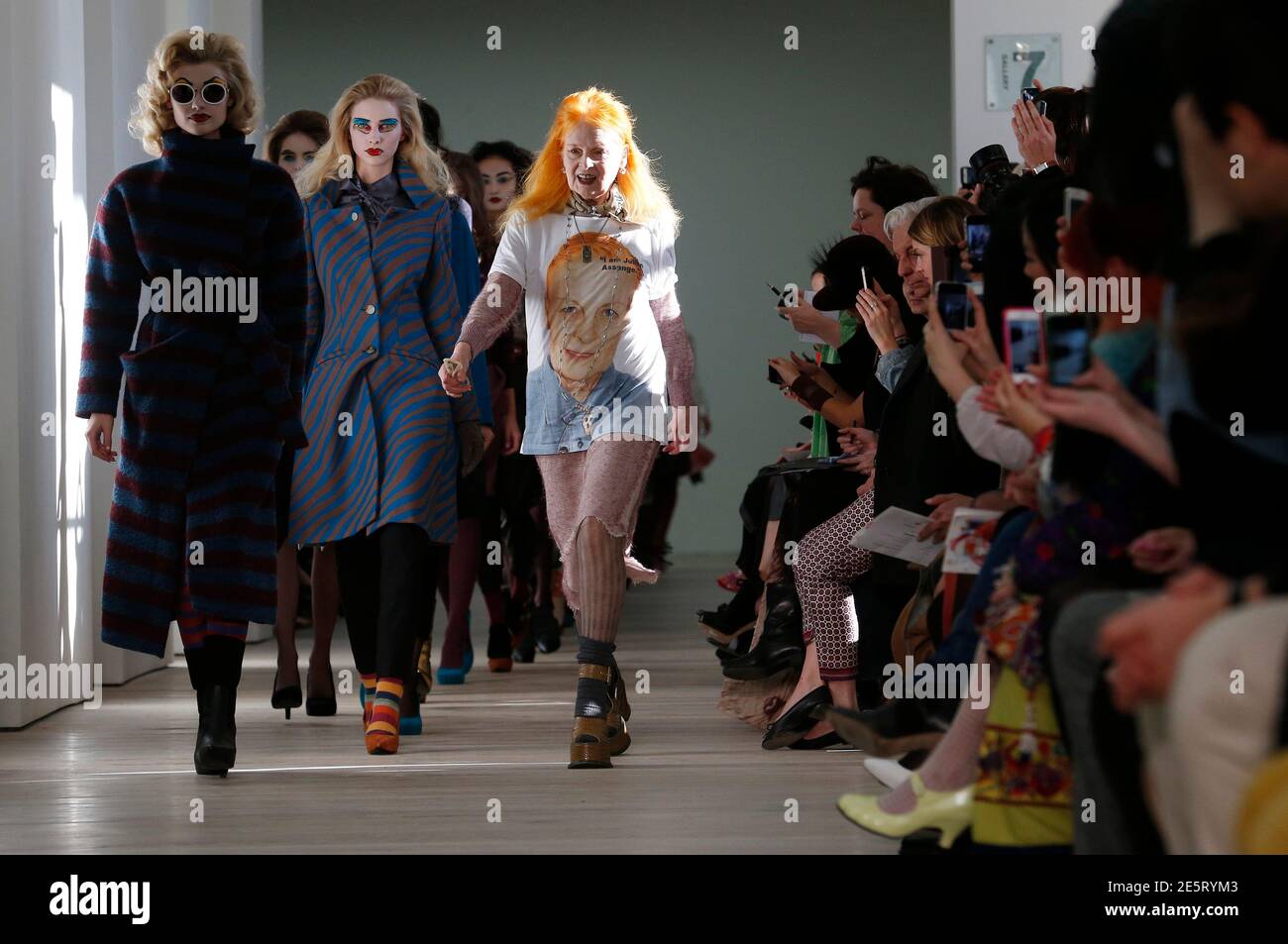 Vivienne Westwood joins her models on the catwalk after the Vivienne Westwood Red Label Autumn/Winter 2013 collection presentation during London Fashion Week, February 17, 2013. REUTERS/Suzanne Plunkett (BRITAIN - Tags: FASHION) Stock Photo