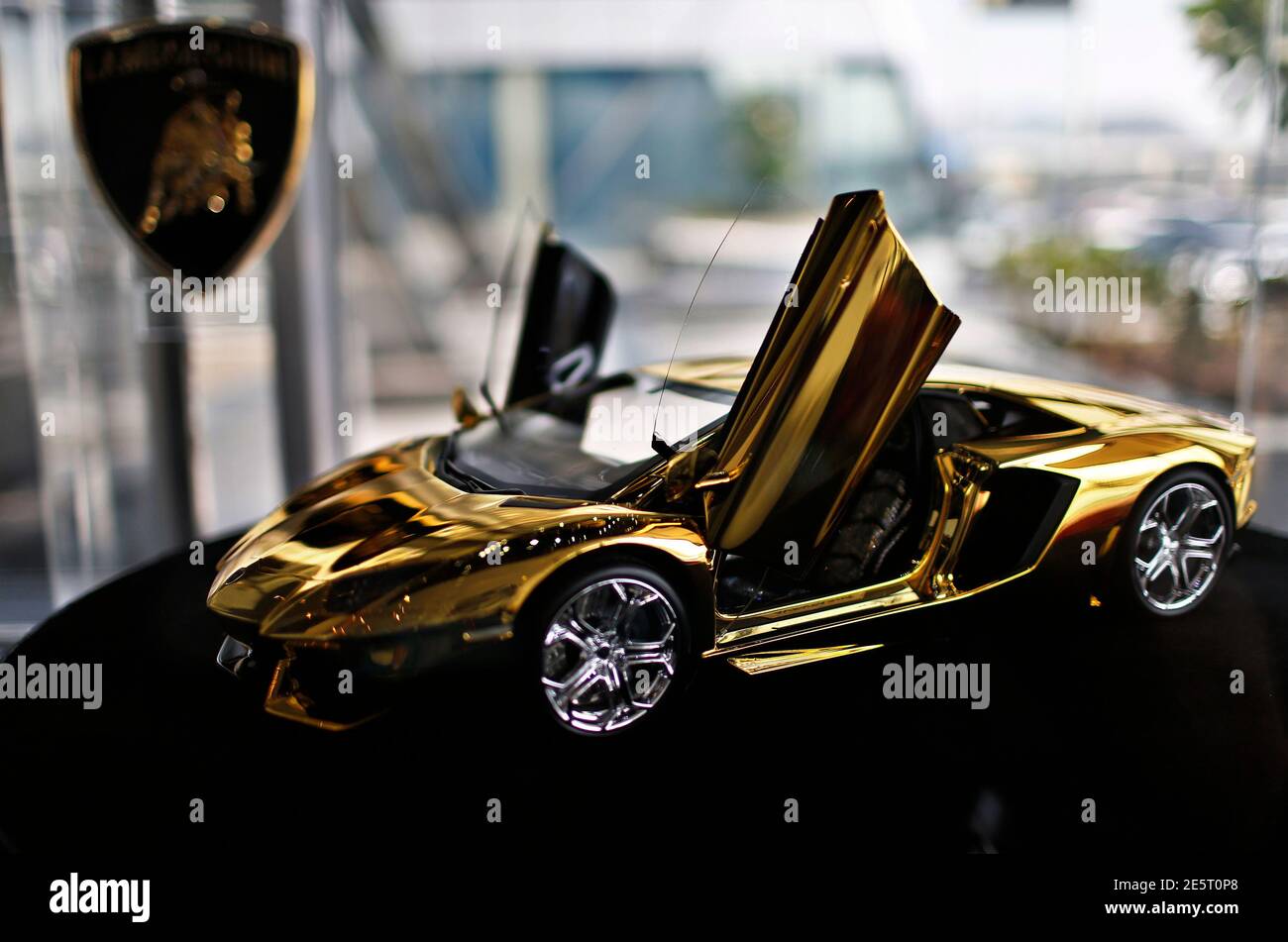 A gold Lamborghini model is on display at the Lamborghini showroom in Dubai  September 19, 2013. A prototype of a model Lamborghini that will be made of  500 kg of gold and
