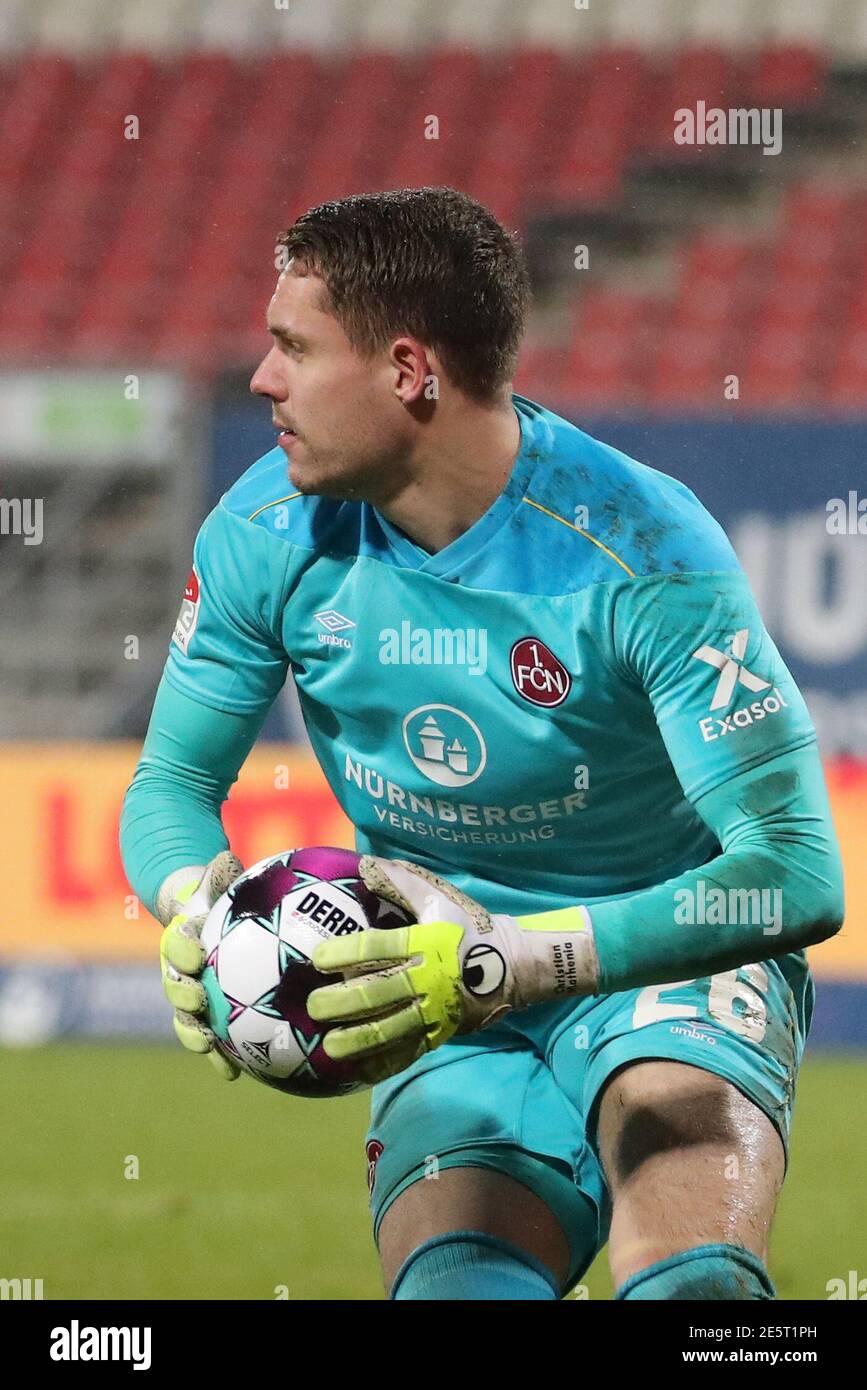 Nuremberg, Germany. 27th Jan, 2021. Football: 2. Bundesliga, 1. FC Nürnberg - Jahn Regensburg, Matchday 18 at Max-Morlock-Stadion. Nuremberg goalkeeper Christian Mathenia in action. Credit: Daniel Karmann/dpa - IMPORTANT NOTE: In accordance with the regulations of the DFL Deutsche Fußball Liga and/or the DFB Deutscher Fußball-Bund, it is prohibited to use or have used photographs taken in the stadium and/or of the match in the form of sequence pictures and/or video-like photo series./dpa/Alamy Live News Stock Photo