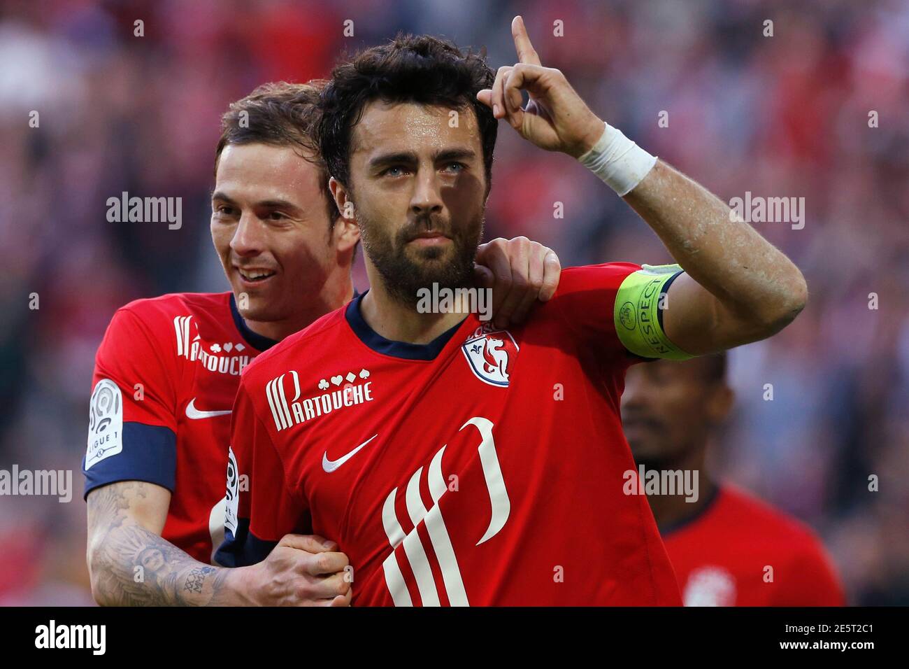 Lille's Marko Basa (R) celebrates with team-mate Nolan Roux his goal during  their French Ligue 1 soccer match against Montpellier at Pierre Mauroy  Stadium in Villeneuve d'Ascq March 9, 2014. REUTERS/Pascal Rossignol (