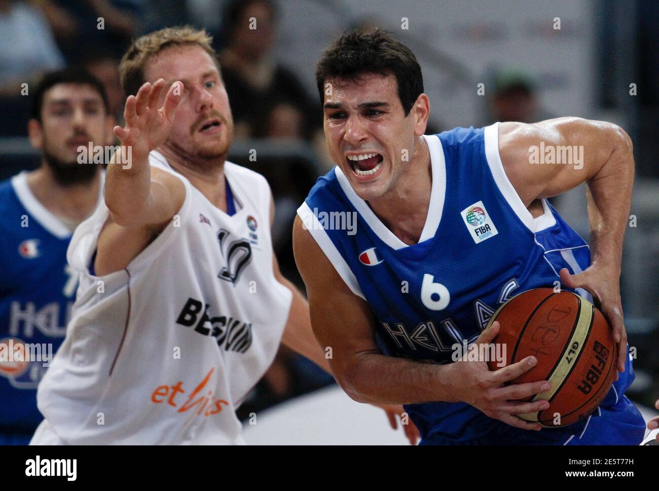 Nikos Zisis (R) of Greece drives past Dimitri Lauwers of Belgium during  their men's basketball BEKO Supercup game in Bamberg August 21, 2011.  REUTERS/Alex Domanski (GERMANY - Tags: SPORT BASKETBALL Stock Photo - Alamy