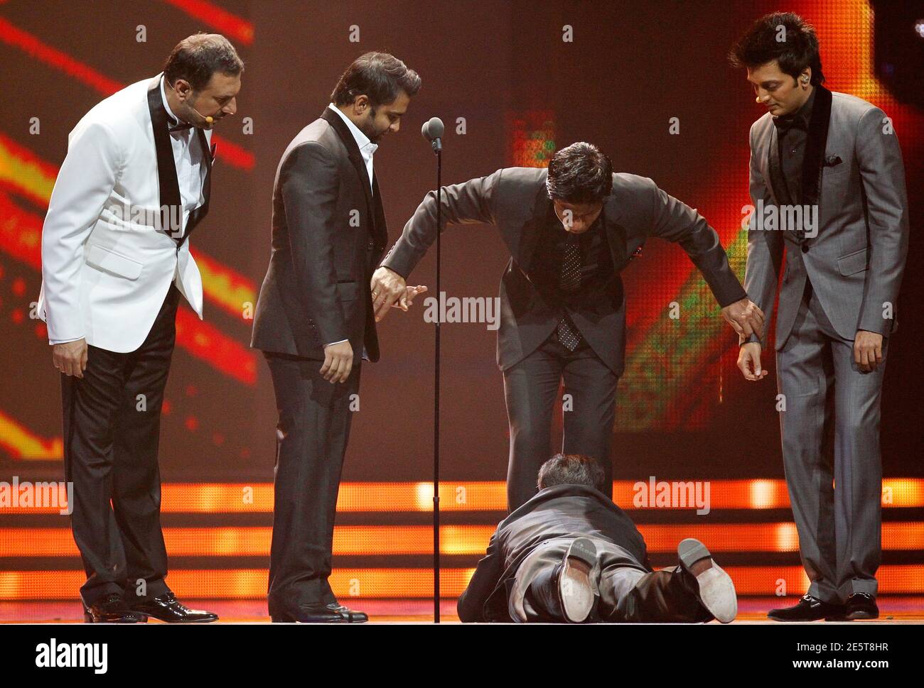 A Fan Dives At The Feet Of Bollywood Actor Shah Rukh Khan C During The International Indian Film Academy Iifa Awards In Toronto June 25 11 Reuters Mark Blinch Canada s Entertainment