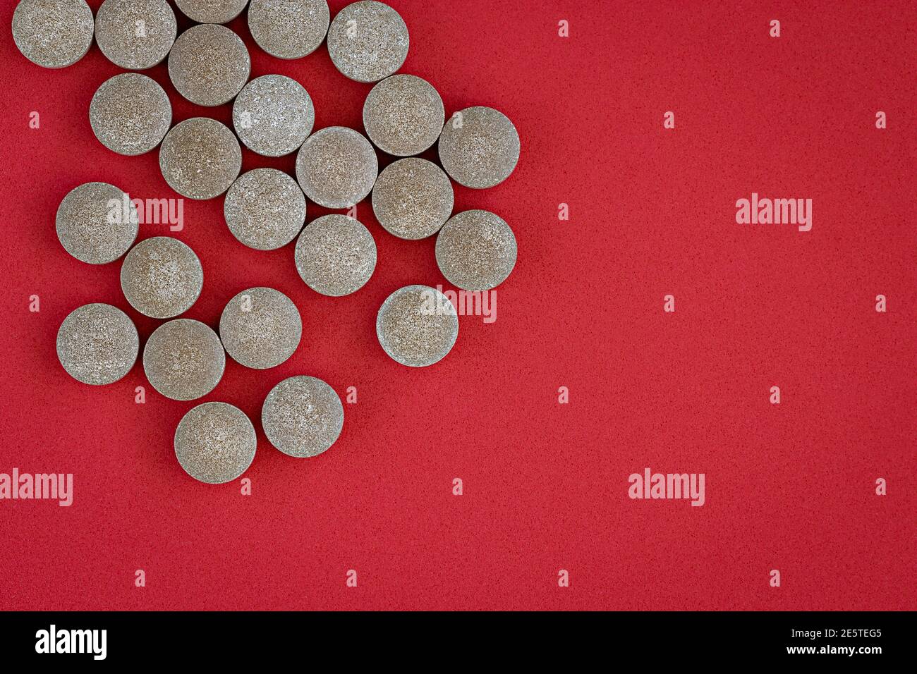 closeup of chelated iron tablets, with negative space. dietary concept