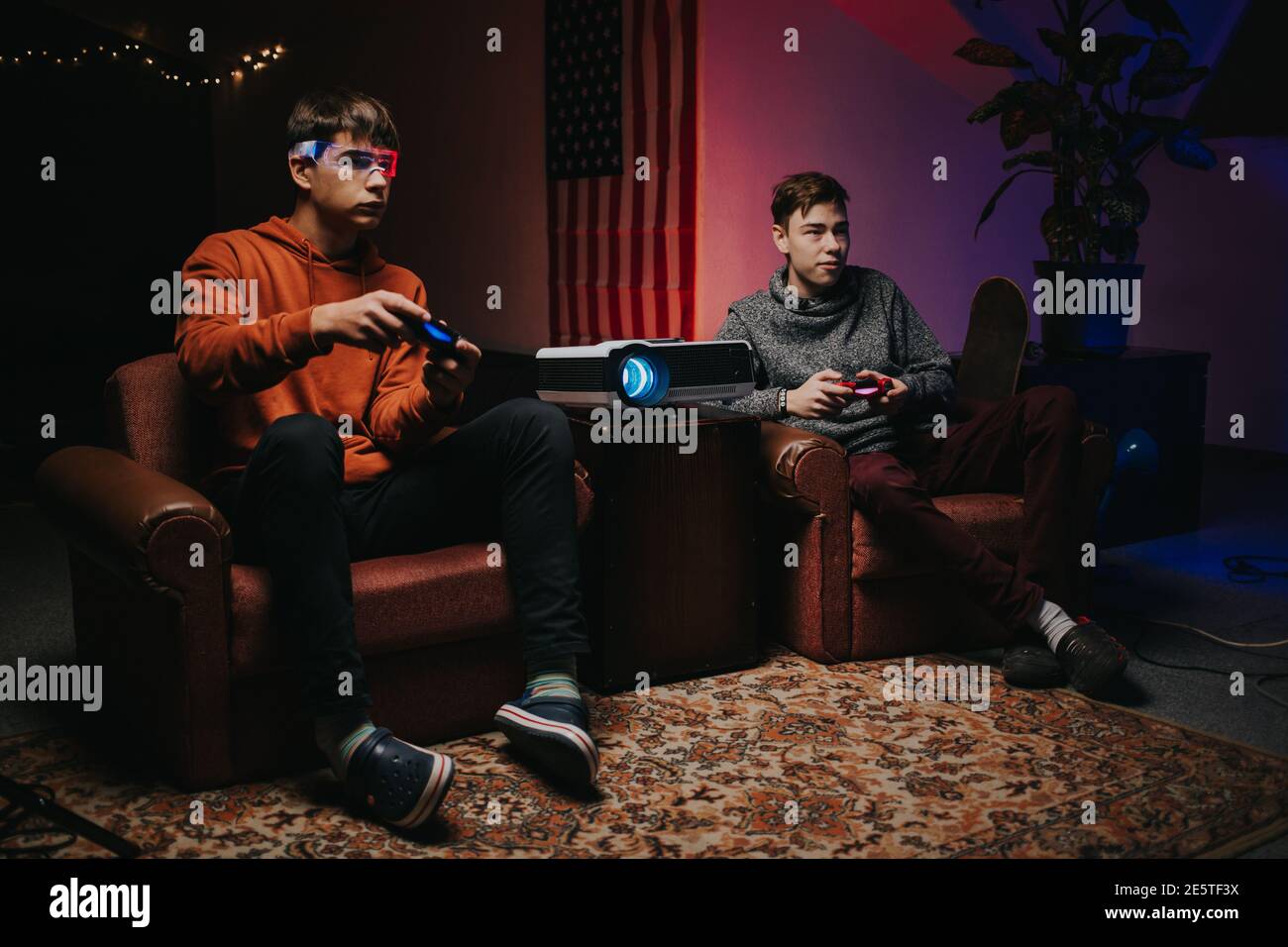 Cheerful gamers with joysticks playing video game Stock Photo Alamy