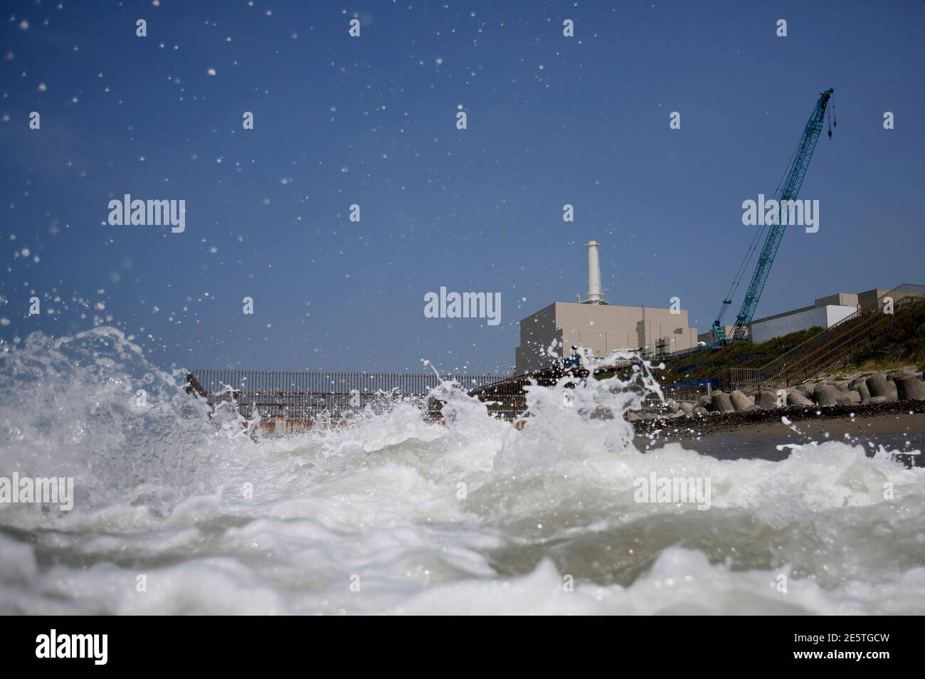 Chubu Electric Power Co S Hamaoka Nuclear Power Station Is Seen Behind Waves At A Beach In Omaezaki Shizuoka Prefecture May 17 13 Chubu Electric Is Spending At Least 1 5 Billion On Safety