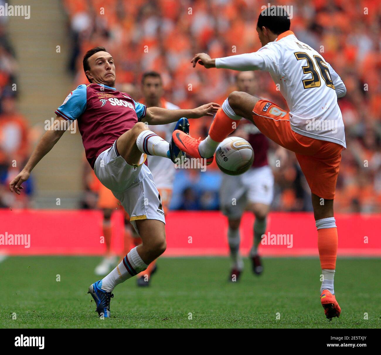 Blackpool's Thomas Ince (R) challenges West Ham United's Mark Noble during their English Championship play-off final soccer match at Wembley Stadium in London May 19, 2012. REUTERS/Eddie Keogh (BRITAIN - Tags: SPORT SOCCER) Stock Photo