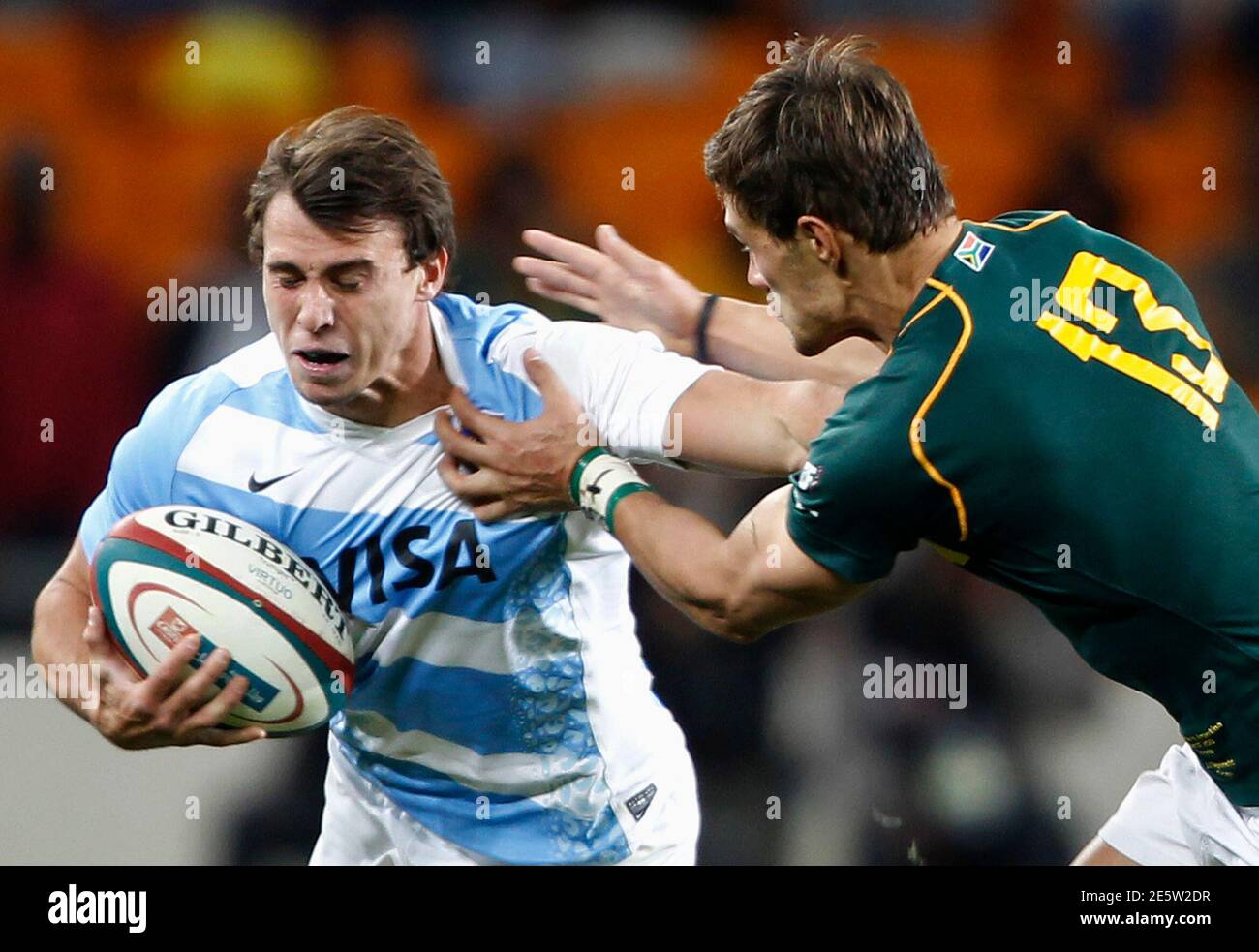 South Africa's JJ Engelbrecht (R) challenges Argentina's Juan Imhoff during  the Rugby Championship test match at the soccer city stadium in Soweto,  August 17, 2013. South Africa is hosting back-to-back rugby and