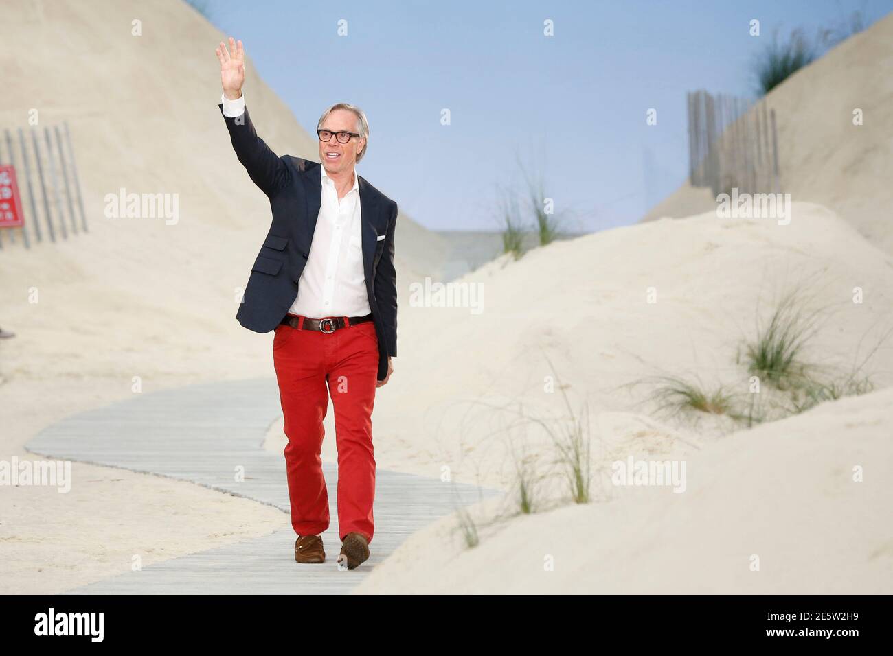 Designer Tommy Hilfiger waves to the crowd after presenting his  Spring/Summer 2014 collection during New York Fashion Week, September 9,  2013. REUTERS/Lucas Jackson (UNITED STATES - Tags: FASHION Stock Photo -  Alamy
