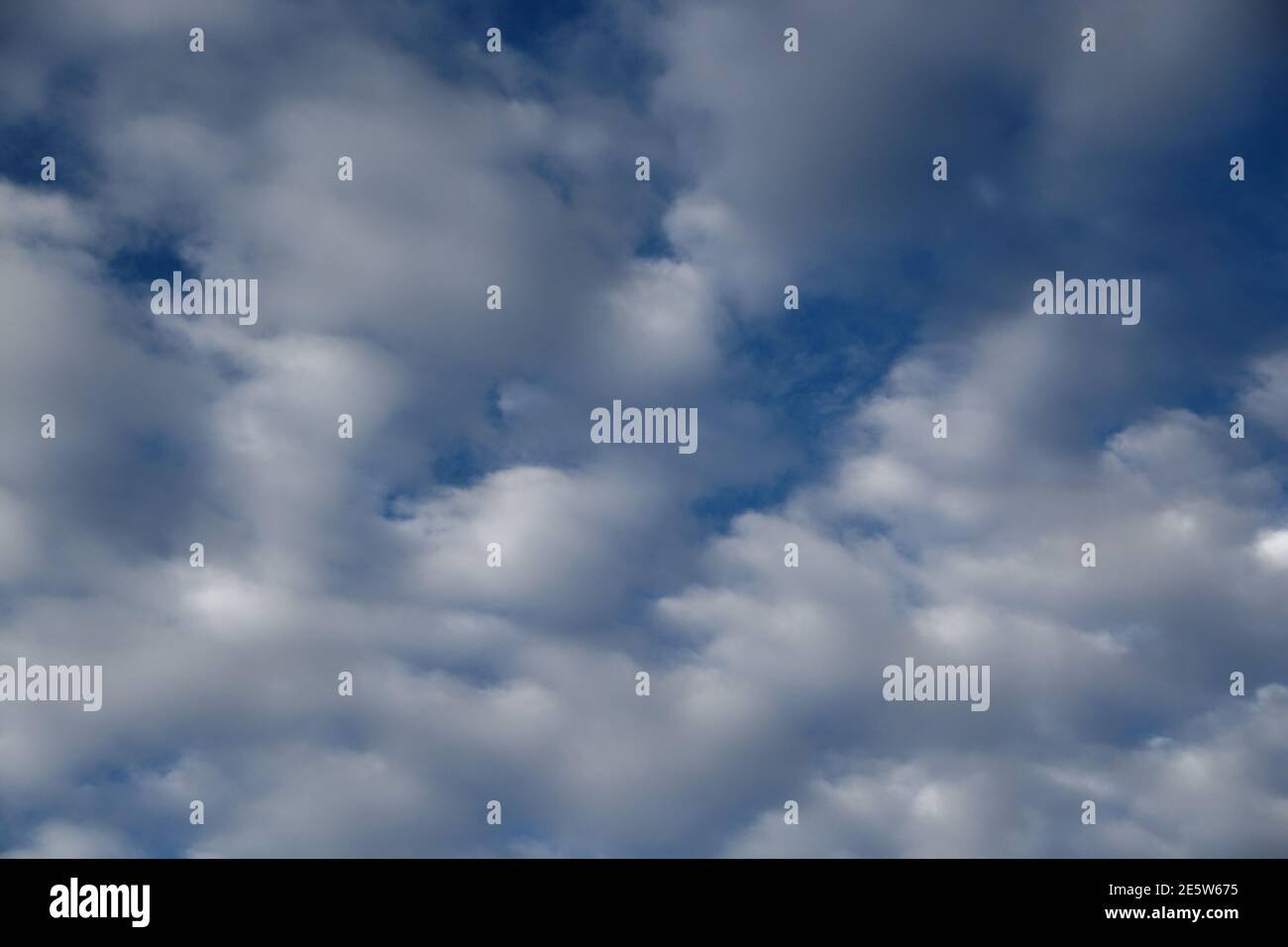 Cloudy Sky Backgrounds - blue and white - a selection of unique background images with a wide variety of shapes and sizes of cloud. Wide Variety Stock Photo