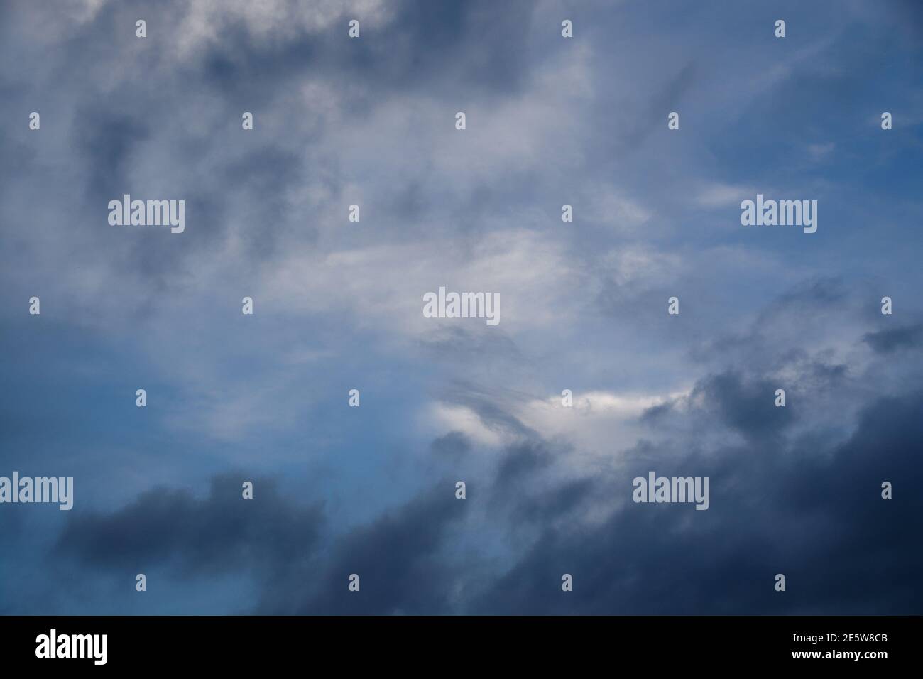Cloudy Sky Backgrounds - blue and white - a selection of unique background images with a wide variety of shapes and sizes of cloud. Wide Variety Stock Photo