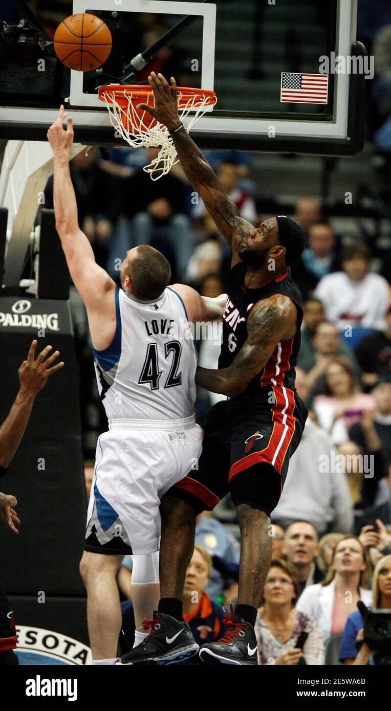 Miami Heat forward LeBron James (6) stops a dunk attempt by Minnesota  Timberwolves forward Kevin Love (42) during the second half of their NBA  basketball game at Target Center in Minneapolis April