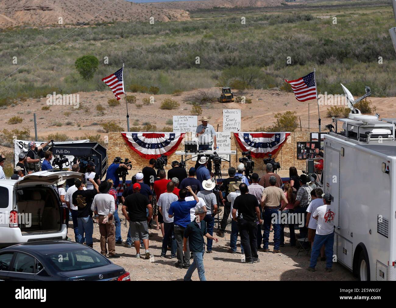 Ammon Bundy (back C), son of rancher Cliven Bundy, talks to protesters in  Bunkerville, Nevada, April 11, 2014. Armed U.S. rangers are rounding up  cattle on federal land in Nevada in a