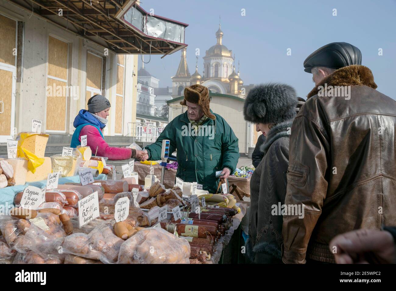 Locals shop at a market in Donetsk, February 15, 2015. The Ukrainian military said on Sunday a ceasefire between government troops and pro-Russian separatists in east Ukraine is being observed 'in general' and that rebel attacks are infrequent and not widespread.  REUTERS/Baz Ratner (UKRAINE - Tags: CIVIL UNREST POLITICS CONFLICT SOCIETY) Stock Photo