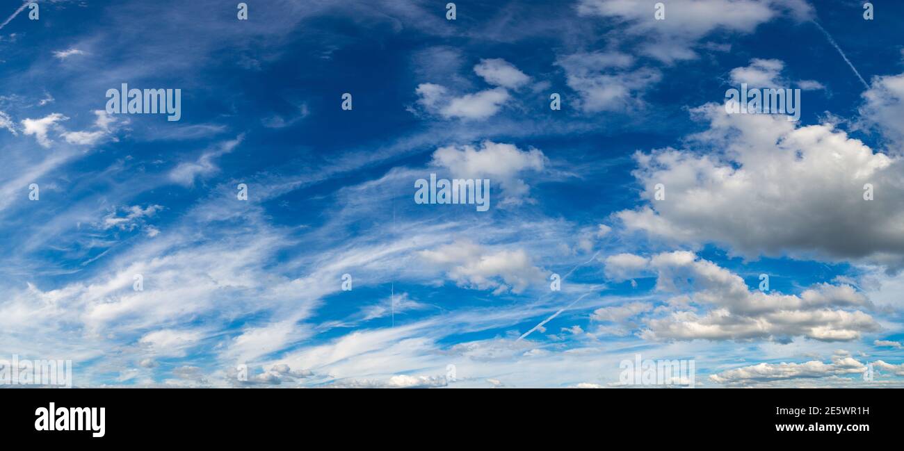 Blue sky with white clouds in a beautiful summer day Stock Photo - Alamy