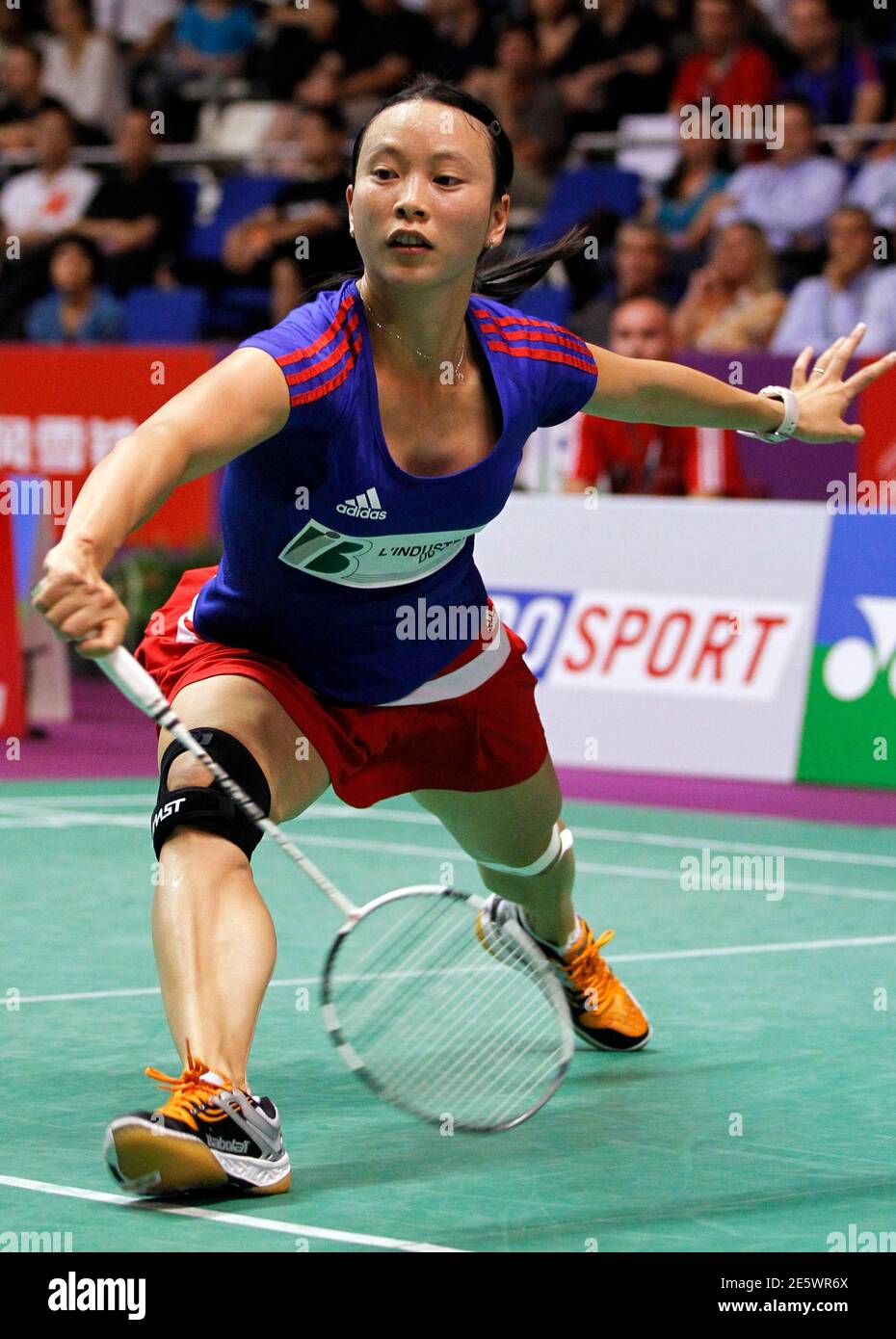 France's Pi Hongyan returns a shot to Ukraine's Elena Prus during their  women's singles match at the 2010 Badminton World Championships at the  Coubertin stadium in Paris August 25, 2010. REUTERS/Charles Platiau (