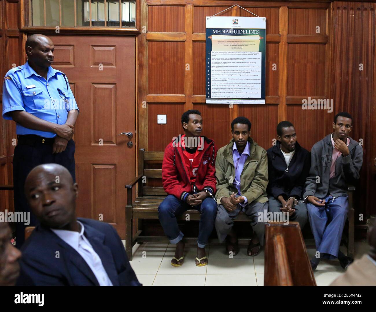 Somali men Mohamed Ahmed Abdi (seated L-R), Liban Abdullah Omar, Adan Mohamed Ibrahim and Hussein Hassan appear at the High Court for bail application in capital Nairobi 12, 2013. A Kenyan court charged the four Somali men last Monday with terrorist offences for helping al Qaeda-linked militants carry out an attack on a shopping mall in Nairobi that killed 67 people. Few details have emerged so far about the how the September attack was masterminded or how gunmen held off Kenyan security forces for four days in the Westgate mall. The assault was claimed by the Somali Islamist group al Shabaab. Stock Photo