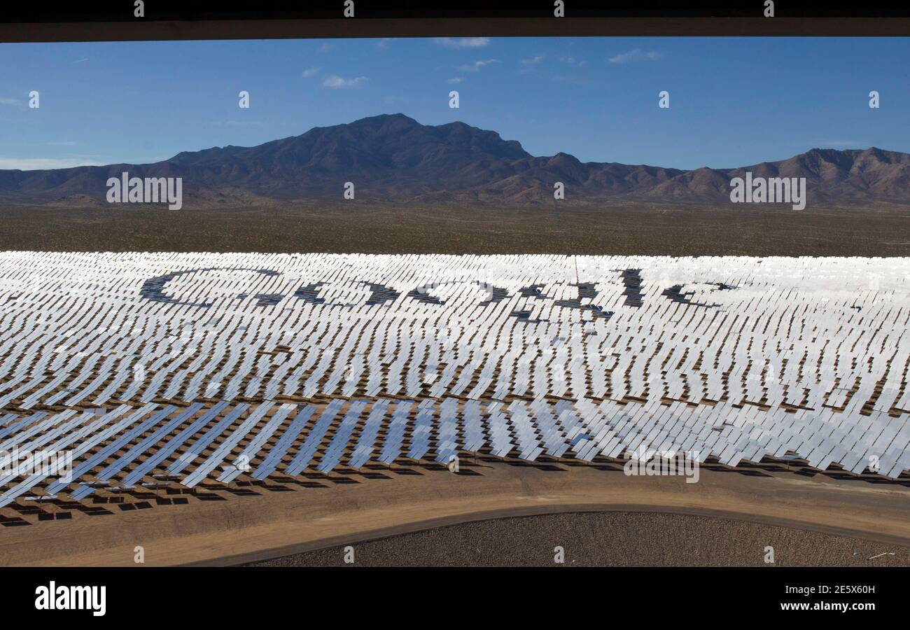 The Google logo is spelled out in heliostats (mirrors that track the sun and reflect the sunlight onto a central receiving point) during a tour of the Ivanpah Solar Electric Generating System in the Mojave Desert near the California-Nevada border February 13, 2014. The project, a partnership of NRG, BrightSource, Google and Bechtel, is the world's largest solar thermal facility and uses 347,000 sun-facing mirrors to produce 392 Megawatts of electricity, enough energy to power more than 140,000 homes. REUTERS/Steve Marcus (UNITED STATES - Tags: ENERGY SCIENCE TECHNOLOGY BUSINESS TPX IMAGES OF T Stock Photo