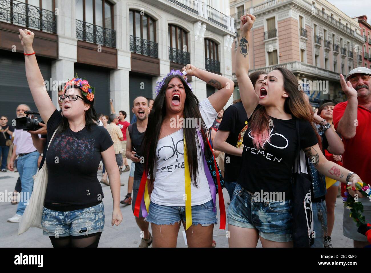 Anti-monarchy demonstrators shout slogans during a Republican protest, after the swearing-in ceremony of Spain's new King Felipe VI in Madrid, at the landmark Puerta del Sol square in Madrid June 19, 2014. Spain's new king, Felipe VI, was sworn in on Thursday in a low-key ceremony which monarchists hope will usher in a new era of popularity for the troubled royal household. REUTERS/Gonzalo Fuentes (SPAIN - Tags: CIVIL UNREST POLITICS ROYALS TPX IMAGES OF THE DAY) Stock Photo