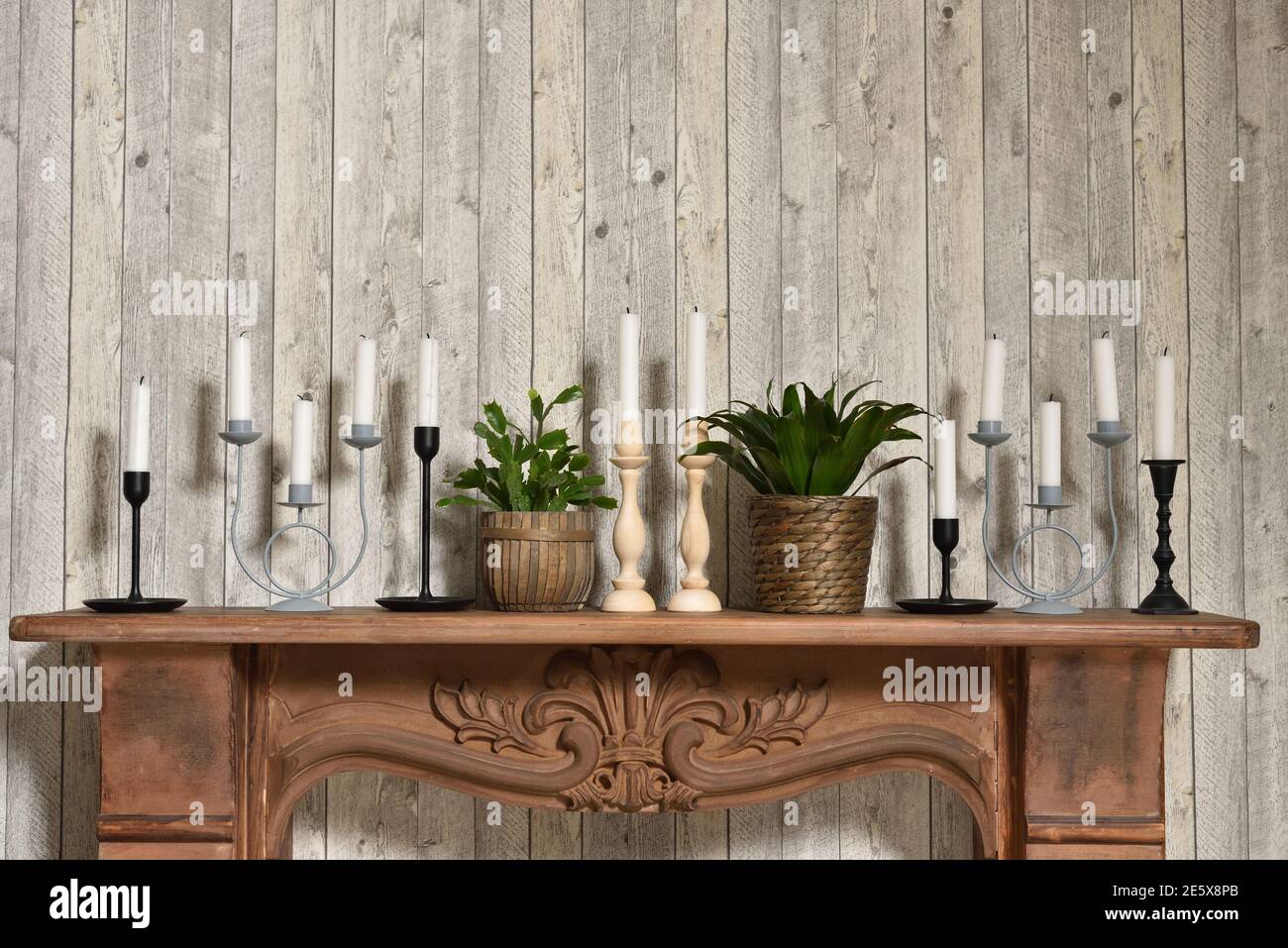 Candles in different candlesticks in the home retro interior Stock