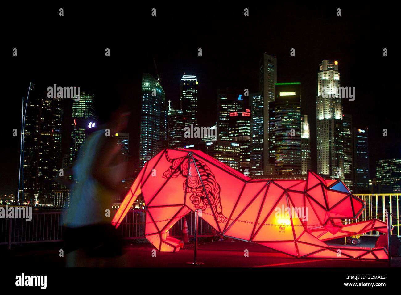 A man jogs past the artwork Digital Origami by Chris Bosse of Germany during "i Light Marina Bay" festival in Singapore November 1, 2010. The festival features 26 art installations