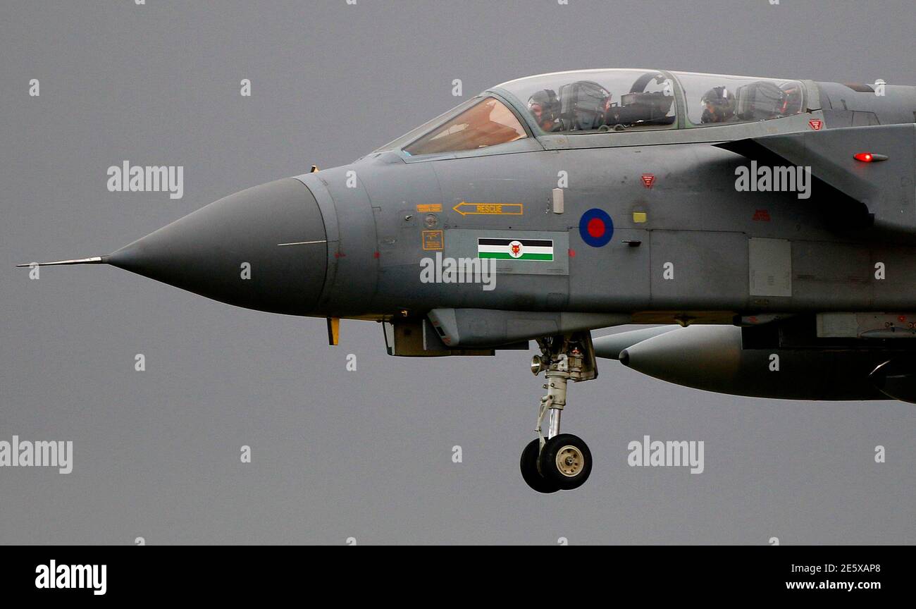 A Royal Air Force Tornado jet prepares to land at the RAF Lossiemouth base in Moray, northern Scotland October 19, 2010. Britain will unveil on Tuesday its first comprehensive review of the armed forces since 1998, a step the government says will prepare the military for the future but which critics say will usher in only spending cuts.  REUTERS/David Moir (BRITAIN - Tags: POLITICS MILITARY CIVIL UNREST) Stock Photo
