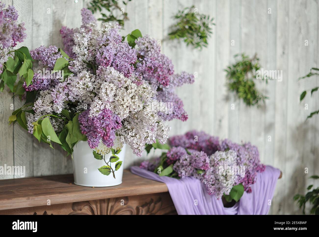 Large bouquet with blooming lilacs in the home interior Stock Photo