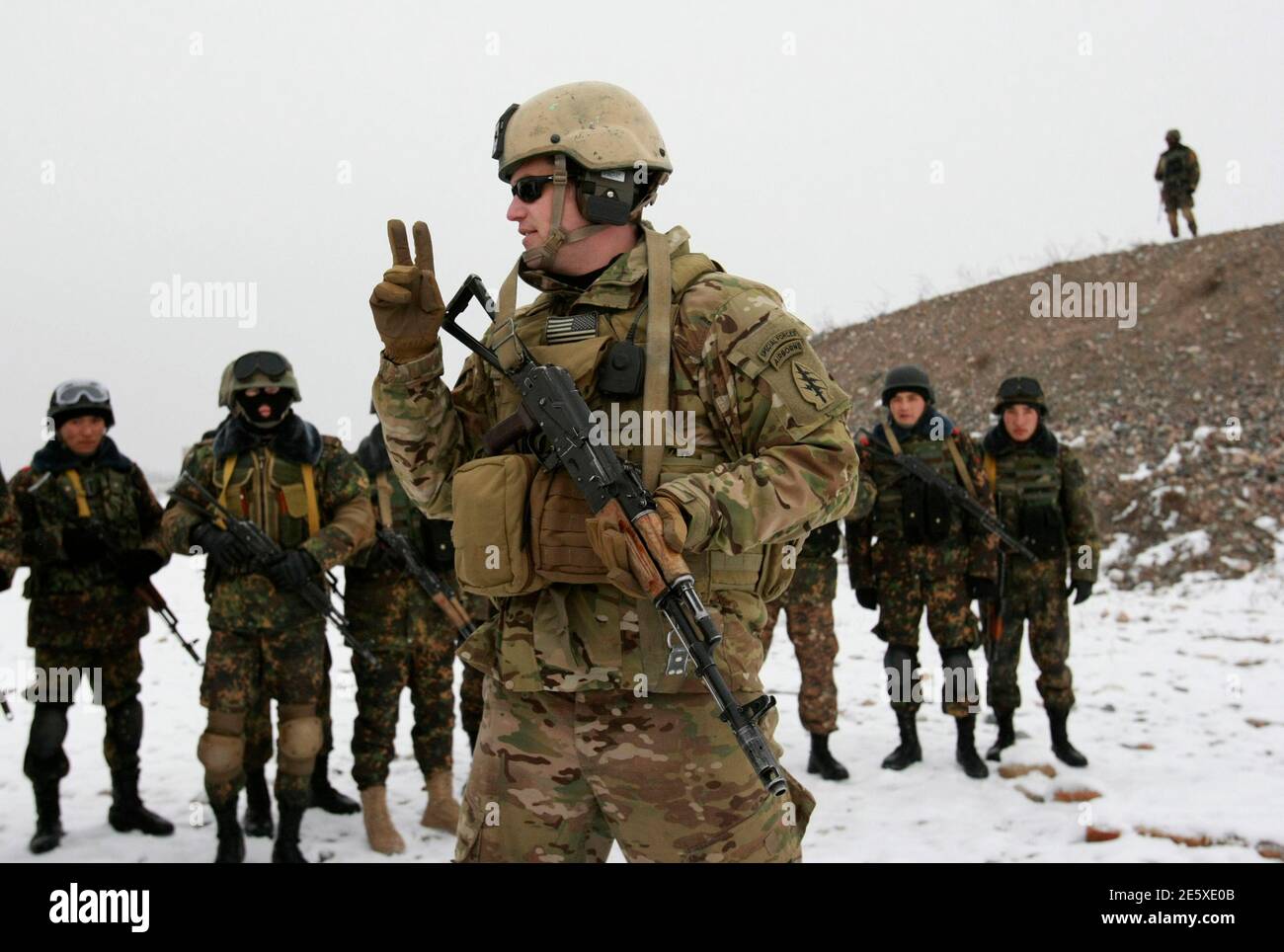 A Member Of The Special Forces Detachment Of The U.s. 3Rd Special Forces Group Demonstrates A Point During A Cooperative Anti-Terrorist Training Exercise Between His Unit And The Kyrgyz "Skorpion" Special Forces