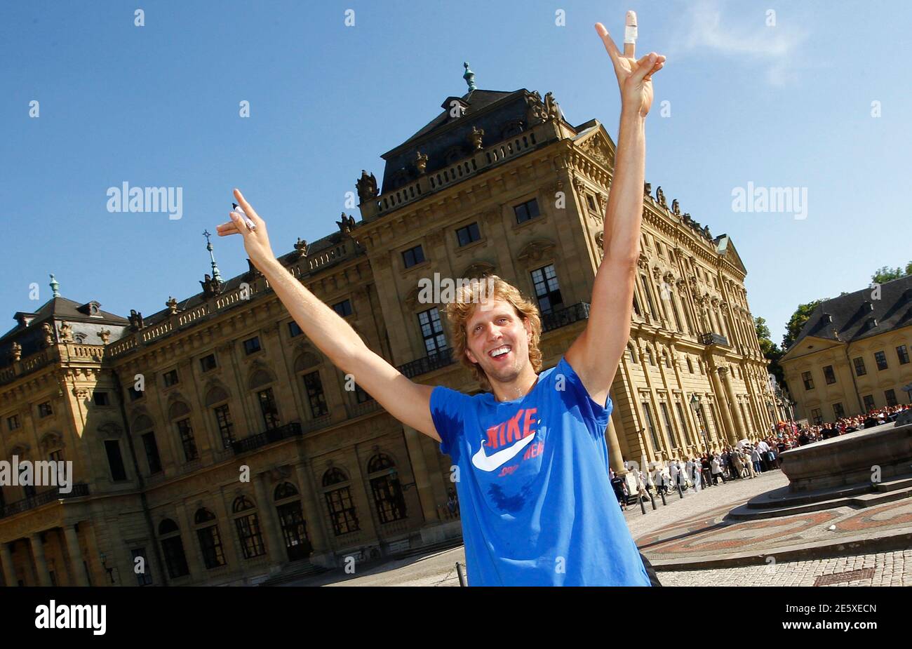 NBA basketball player Dirk Nowitzki waves to waiting fans as he arrives in front of the Wuerzburg Residenz during a visit to his German home town of Wuerzburg, June 28, 2011. Nowitzki became the first German to win an NBA title when his basketball team Dallas Mavericks beat the Miami Heat last weeki, giving the Mavericks their first championship in their 31 year history. Nowitzki was also named the Most Valuable Player of the Championship series.          REUTERS/Kai Pfaffenbach (GERMANY  - Tags: SPORT BASKETBALL) Stock Photo
