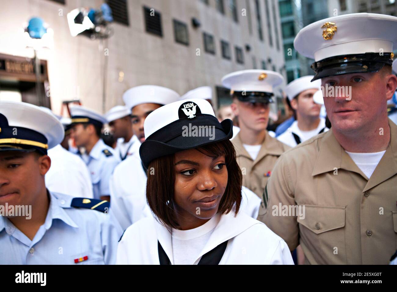 Aviation Ordnanceman second class (AO2) Tyesha Beal, of Norfolk, VA, waits for Singer Bobby Brown to perform on NBC's 'Today' show in New York, May 28, 2012.  REUTERS/Andrew Burton (UNITED STATES - Tags: MILITARY ENTERTAINMENT) Stock Photo