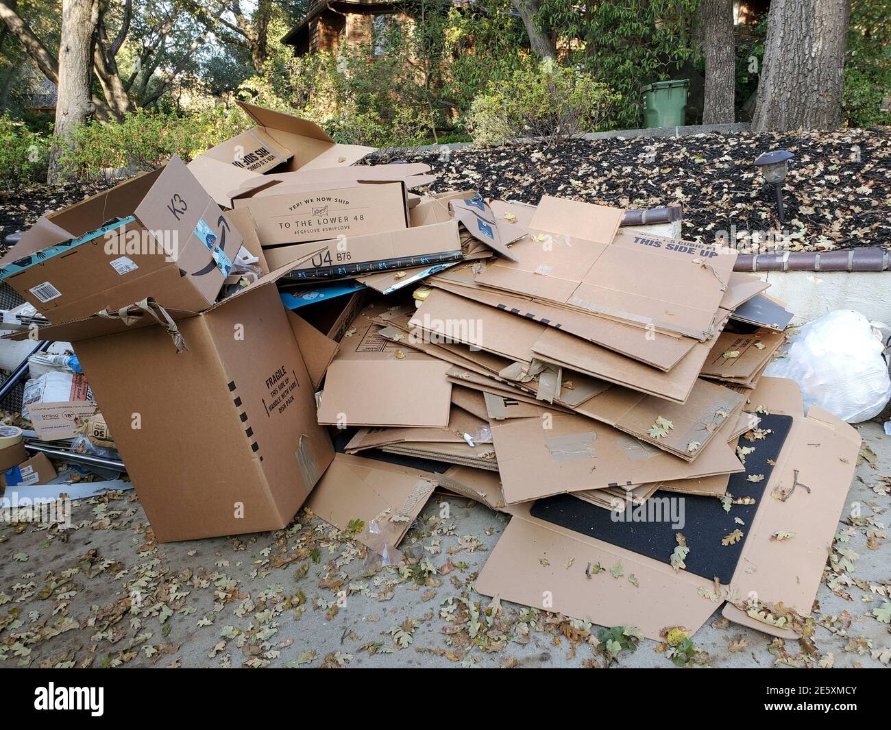 Photograph of a heap of compressed cardboard moving boxes following a