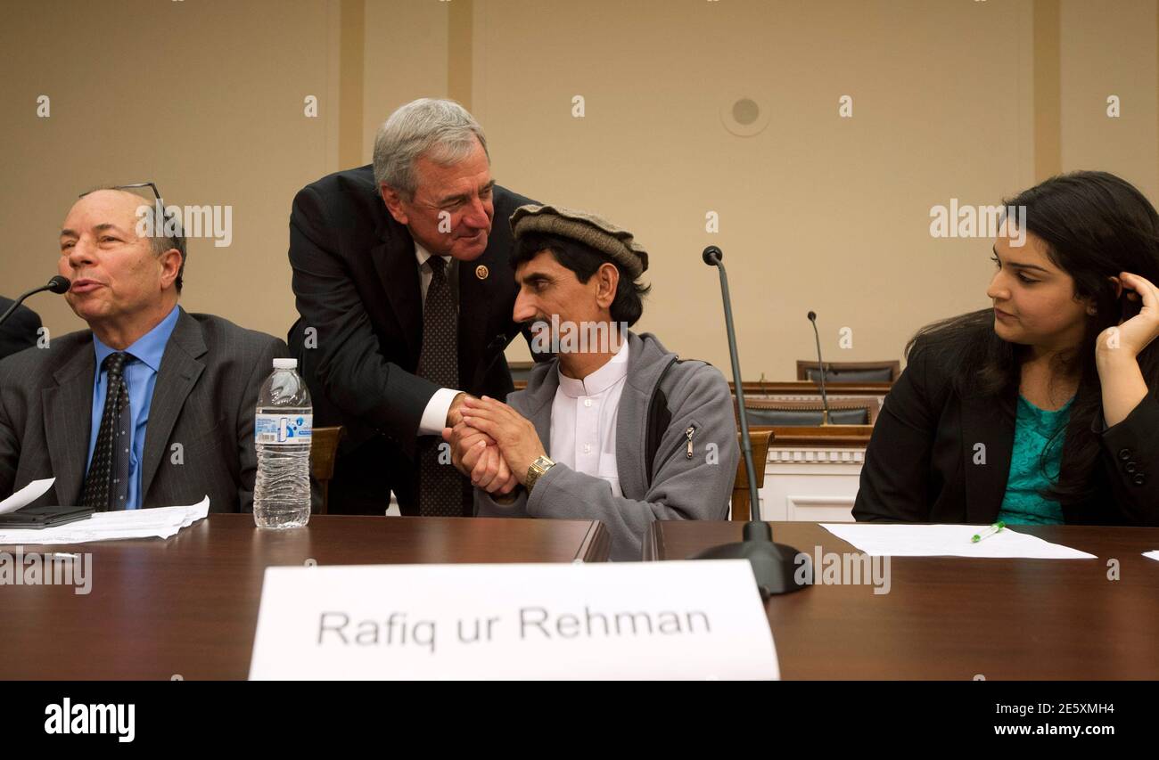 U.S. Rep. Rick Nolan (D-MN) offers his condolences to Pakistani national Rafiq ur Rehman at the end of a news conference about the U.S. drone strike which killed his mother, on Capitol Hill in Washington October 29, 2013. Rafiq and his children attended the news conference on Tuesday to highlight the personal costs in collateral damage for civilians killed and injured in the U.S. drone strike program.     REUTERS/Jason Reed   (UNITED STATES - Tags: POLITICS MILITARY) Stock Photo