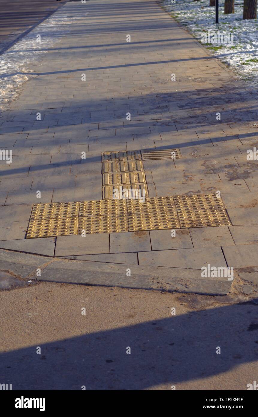 Special tactile tiles on the sidewalk for people with vision problems