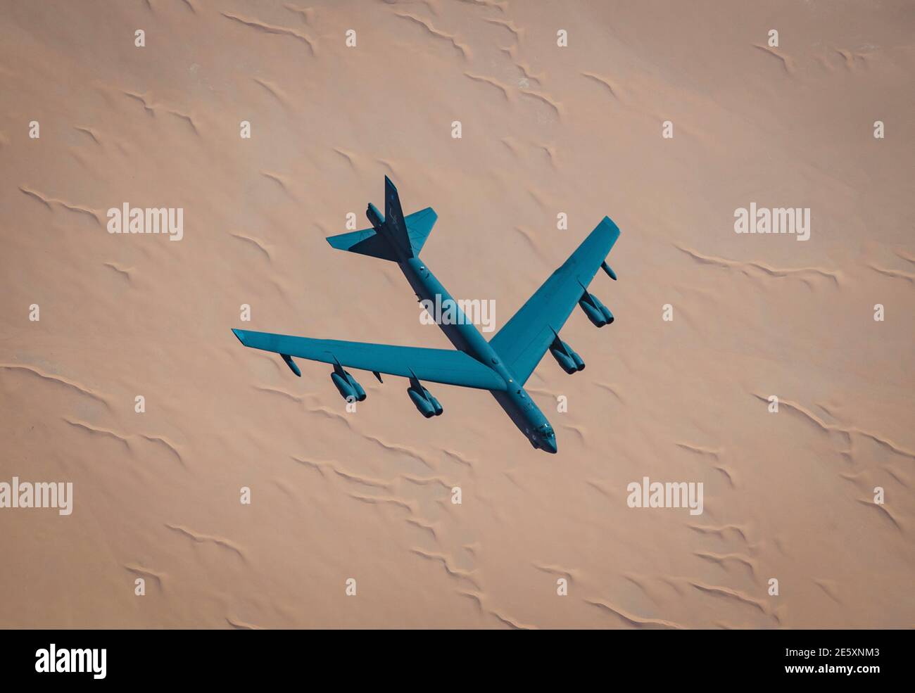 Persian Gulf, Saudi Arabia. 27th Jan, 2021. A U.S. Air Force B-52 Stratofortress strategic bomber from the 2nd Bomb Wing flies over the desert after reruelingl from a KC-135 Stratotanker during a short-duration deployment to the middle east January 27, 202 over the Persian Gulf. Credit: Planetpix/Alamy Live News Stock Photo