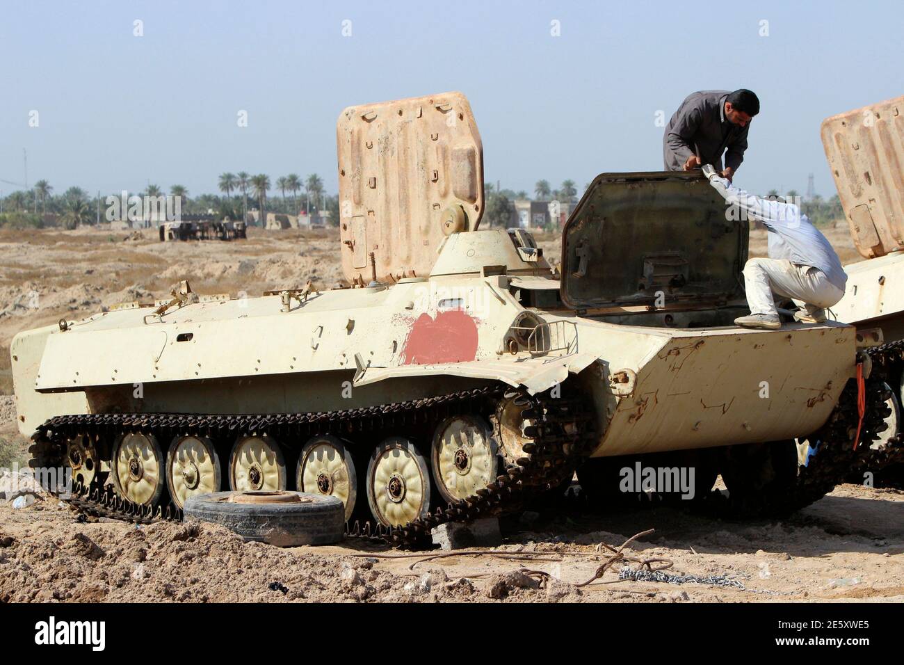 A Metalworker Fixes A Tank, Known As Duldul, In Basra, Southeast Of  Baghdad, March 4, 2015. In A Military Scrapyard In The Southern Iraqi  Desert, Abandoned Army Equipment Sat For Years Waiting
