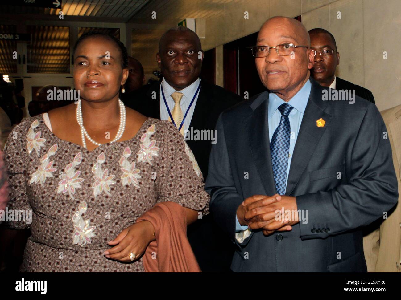 South Africa's President Jacob Zuma (R) talks to his International Relations Minister Maite Nkoana-Mashabane as they arrive at the 16th African Union Summit, in Ethiopia's capital Addis Ababa, January 31, 2011. The presidents of South Africa, Tanzania, Mauritania, Burkina Faso and Chad will form a high-level panel tasked with resolving Ivory Coast's leadership dispute, an African Union official said on Monday. REUTERS/Thomas Mukoya (ETHIOPIA - Tags: SOCIETY POLITICS) Stock Photo