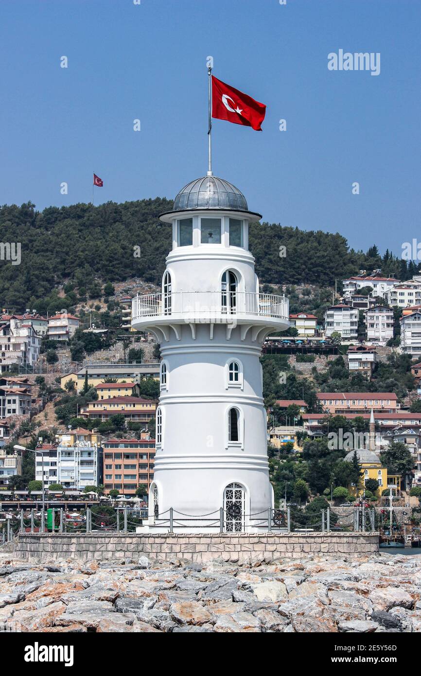 Lighthouse or beacon with fluttering flag of Turkey in Alanya Stock Photo