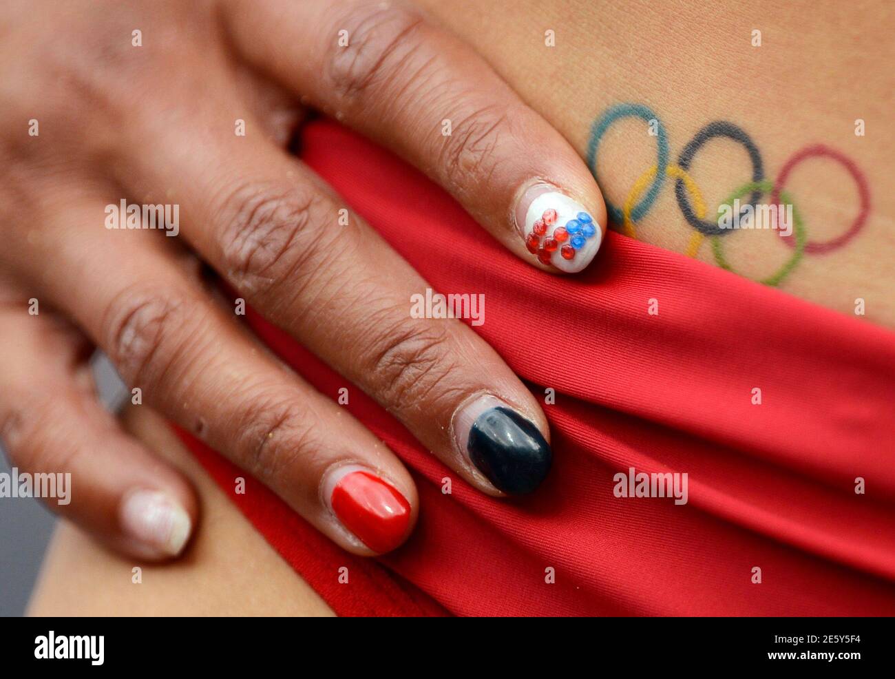 The nails and tattoo of Hyleas Fountain of the . are seen as she  competes in her women's heptathlon Group B long jump event at the London  2012 Olympic Games at the