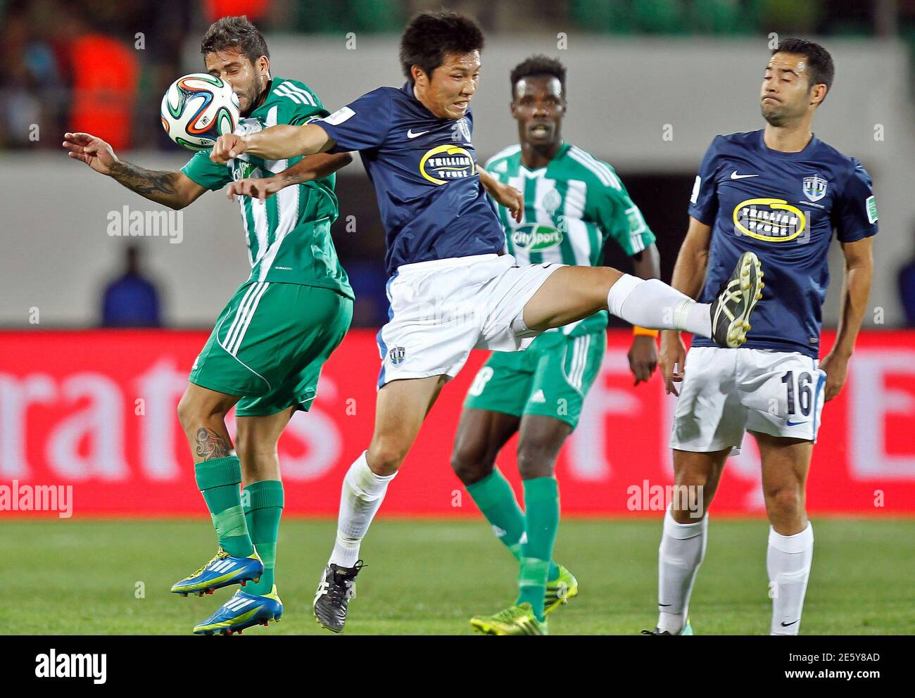 Takuya Iwata C Of Auckland City Fc Fights For The Ball With Mohsine Moutaouali L Of Raja Casablanca During Their Fifa Club World Cup Soccer Match At Agadir Stadium In Agadir December