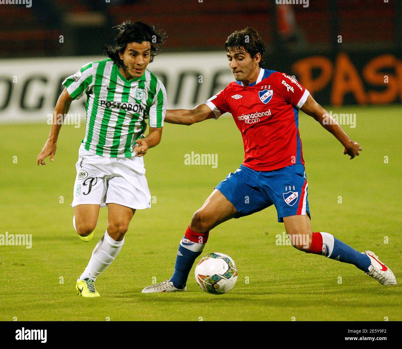 Sherman Cardenas L Of Colombia S Atletico Nacional And Maximiliano Calzada Of Uruguay S Nacional Fight For The Ball During Their Copa Libertadores Soccer Match In Medellin March 11 2014 Reuters Albeiro Lopera