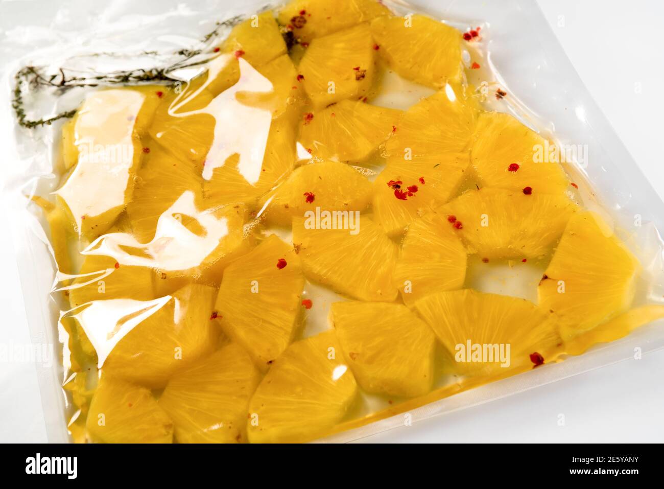 pineapple slices vacuum packed for sous vide Stock Photo - Alamy