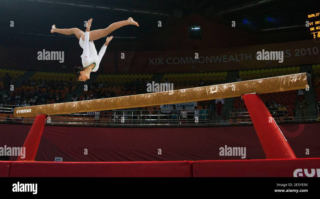 Charlotte McKenna of Northern Ireland competes on the balance beam during  team gymnastics at the Commonwealth Games in New Delhi October 5, 2010.  REUTERS/Andy Clark (INDIA - Tags: SPORT GYMNASTICS Stock Photo - Alamy