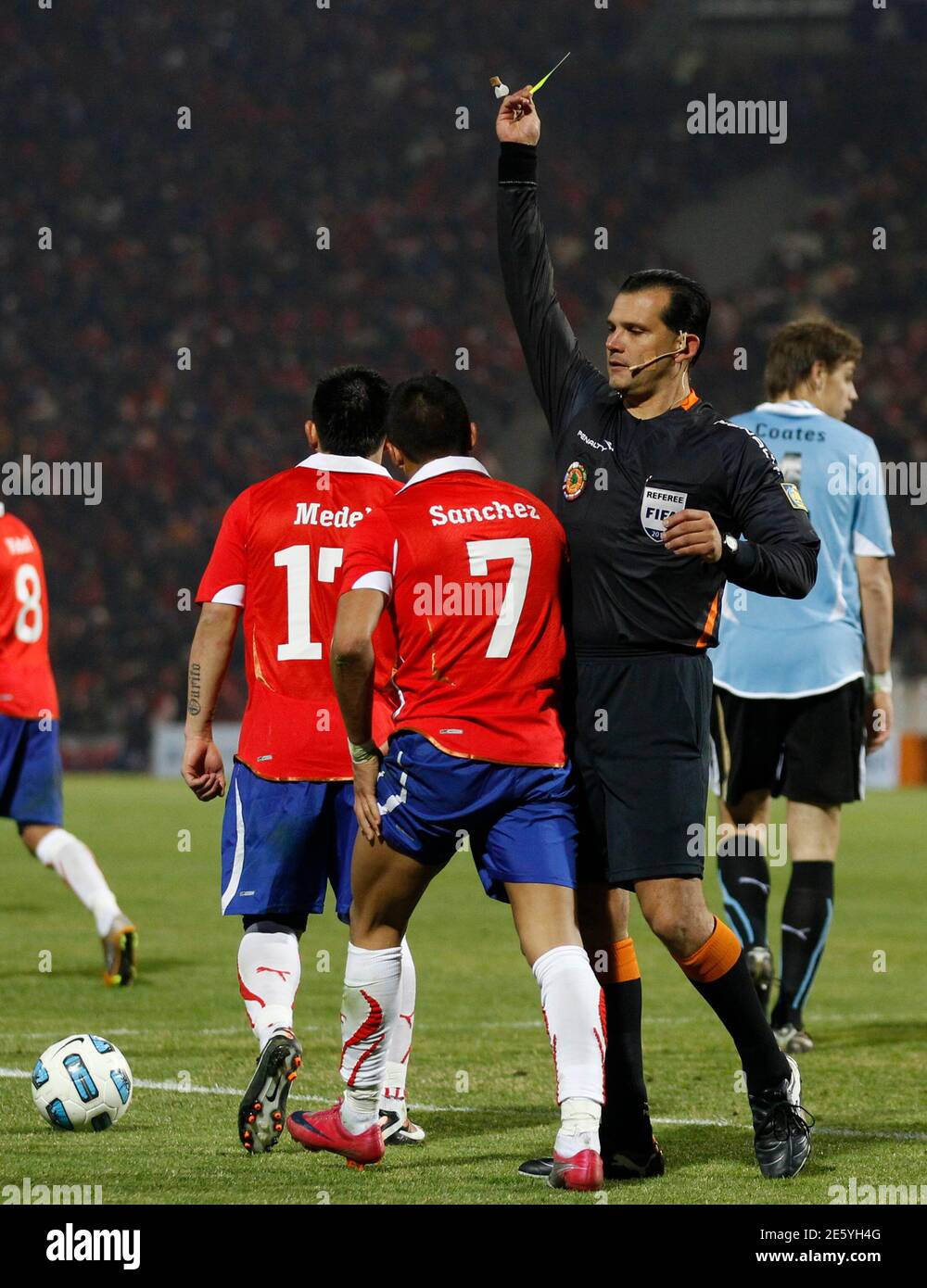 Referee Carlos Amarilla R Of Paraguay Gives A Yellow Card To Chile S Alexis Sanchez 7 During Their Match Against Uruguay In The First Round Of The Copa America Soccer Tournament In Mendoza